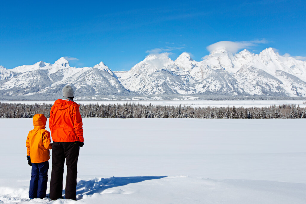 Father and son in front of the tetons